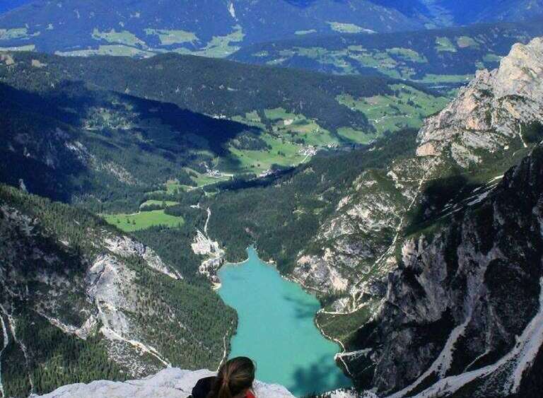 Explore breathtaking mountain views and a stunning turquoise lake.