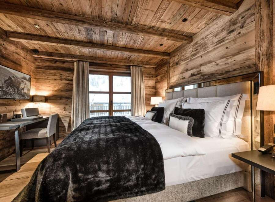 Experience rustic luxury in this stunning bedroom.