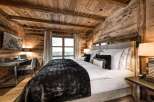 Experience rustic luxury in this stunning bedroom.