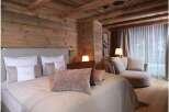 Experience rustic elegance in this cozy bedroom.