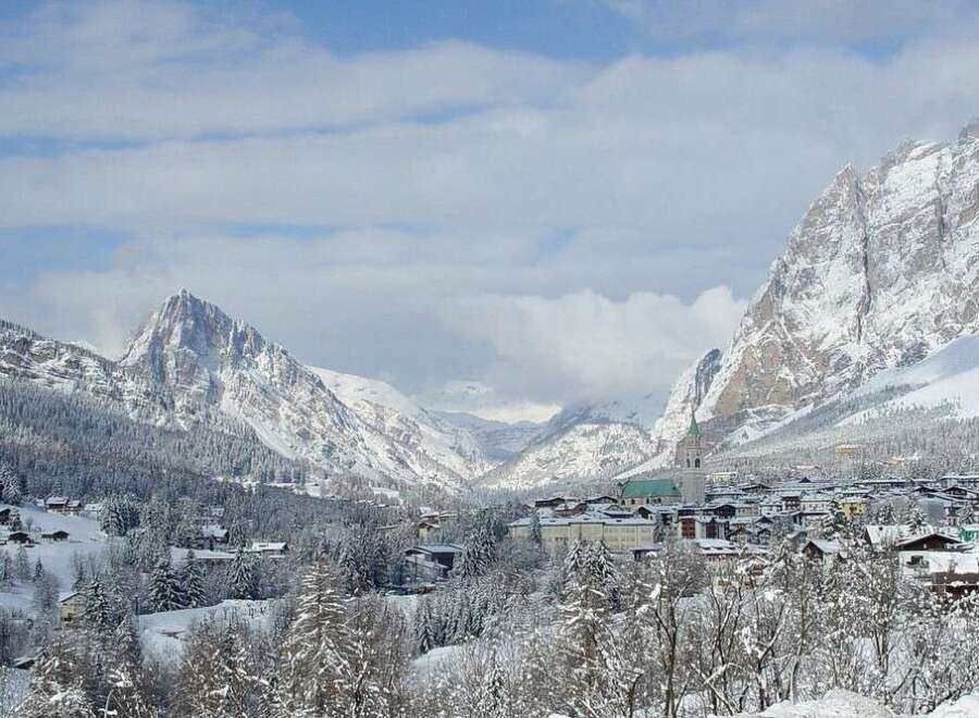 Experience the breathtaking beauty of a snow-covered mountain village.