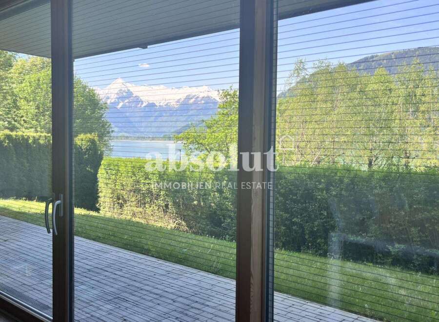 Experience breathtaking mountain and lake views from this stunning property.