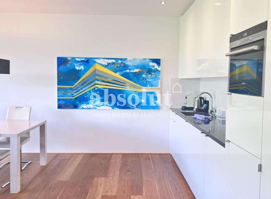 Discover modern living in this stunning property! Featuring a sleek, contemporary kitchen with high-end appliances and ample counter space.