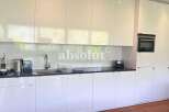 Discover modern living in this stunning kitchen! Featuring sleek white cabinetry and a contemporary design, this space is perfect for culinary enthusiasts.
