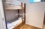 Cozy bunk beds offer a comfortable sleeping arrangement, perfect for families or groups.