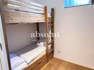 Cozy bunk beds offer a comfortable sleeping arrangement, perfect for families or groups.
