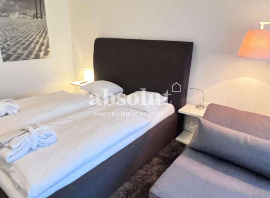 Discover a cozy bedroom with a comfortable bed, perfect for relaxation.