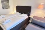 Discover a cozy bedroom with a comfortable bed, perfect for relaxation.