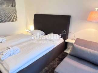 Discover a cozy bedroom with a comfortable bed, perfect for relaxation.