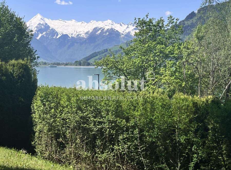 Experience breathtaking views of the snow-capped mountains and serene lake from this stunning property.