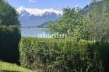 Experience breathtaking views of the snow-capped mountains and serene lake from this stunning property.