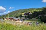 Discover the charm of mountain living in this picturesque village nestled amidst lush greenery.
