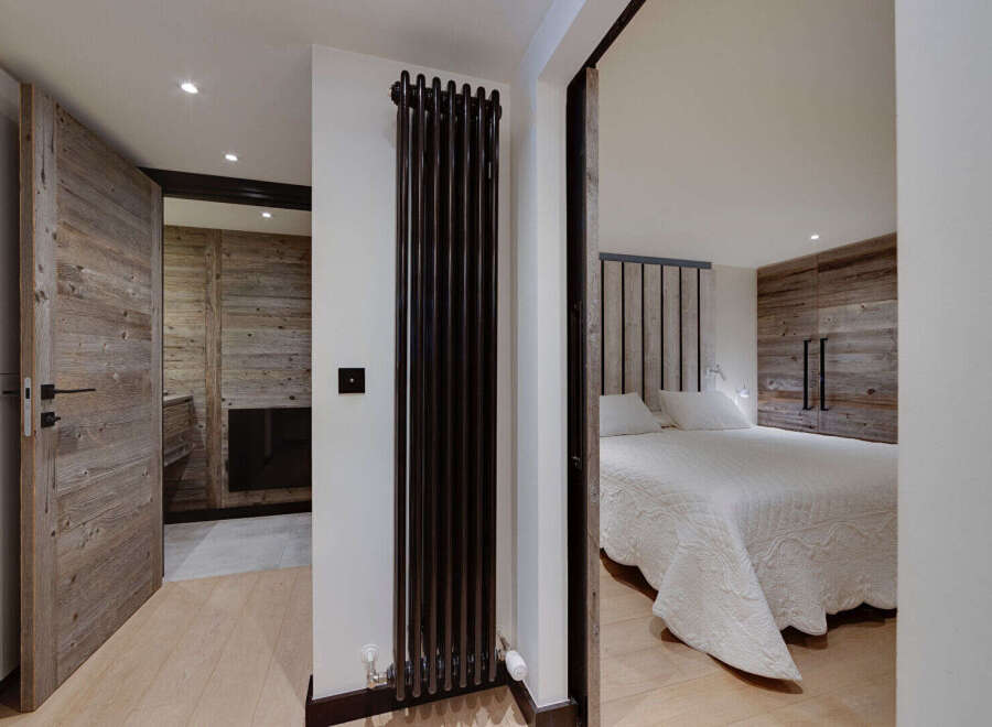 Step into luxury with this stunning property, showcasing exquisite wooden accents and a modern design.