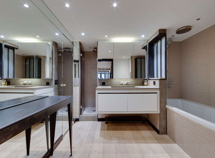 Step into luxury with this stunning bathroom featuring a sleek, modern design.