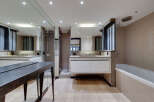 Step into luxury with this stunning bathroom featuring a sleek, modern design.