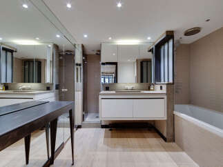 Step into luxury with this stunning bathroom featuring a sleek, modern design.