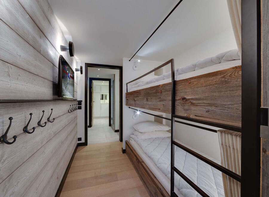 This charming ski chalet features a cozy bunk room perfect for families or groups.