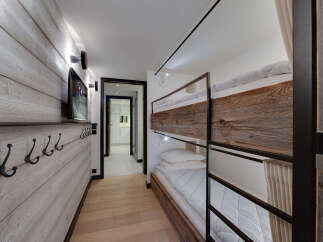 This charming ski chalet features a cozy bunk room perfect for families or groups.