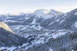 Experience the charm of a snow-covered mountain village nestled in a picturesque valley.