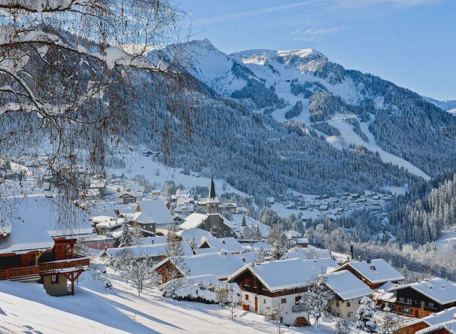 Nestled in a picturesque winter wonderland, this charming property offers stunning views of snow-capped mountains and a quaint village.