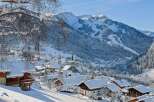 Nestled in a picturesque winter wonderland, this charming property offers stunning views of snow-capped mountains and a quaint village.