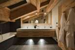 Experience rustic luxury in this stunning bathroom.