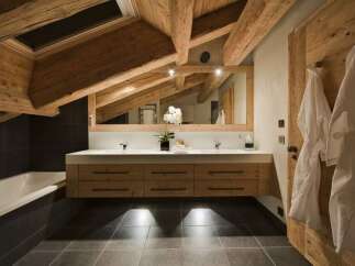 Experience rustic luxury in this stunning bathroom.