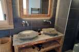 Experience rustic elegance in this stunning bathroom.