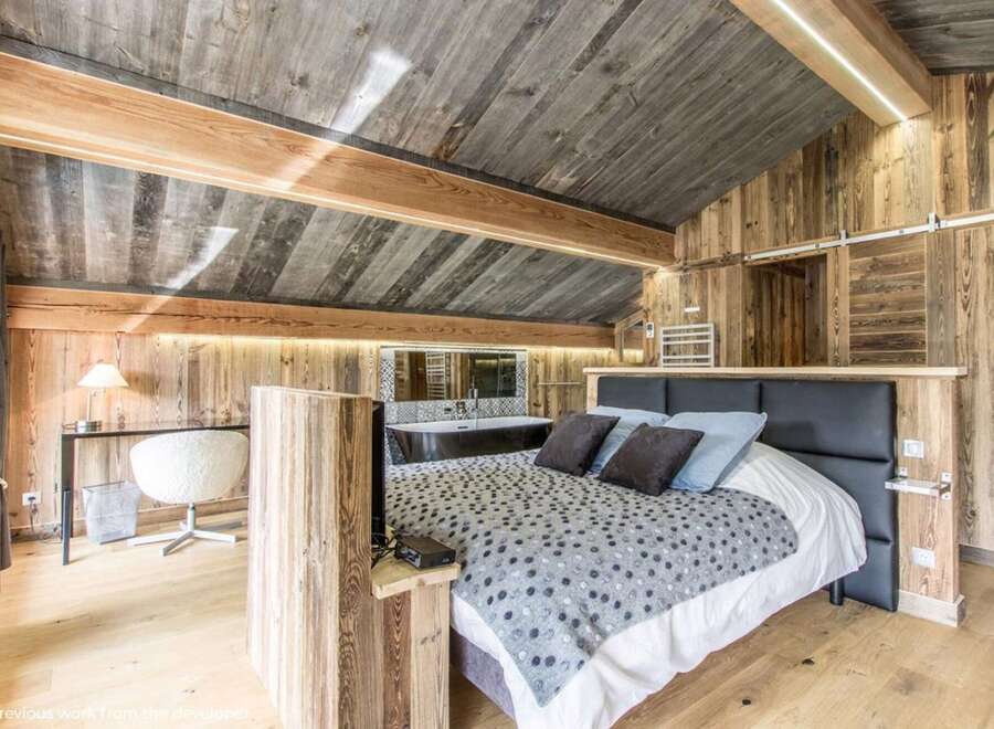 Experience rustic luxury in this stunning bedroom.