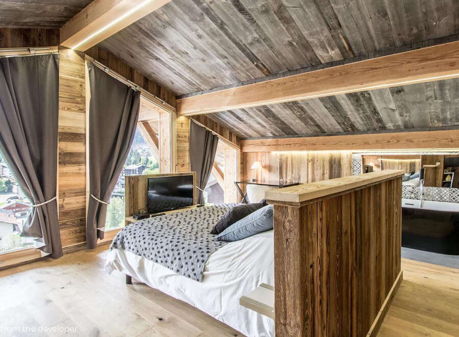 Experience rustic luxury in this stunning bedroom.