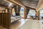 Experience luxury in this stunning chalet-style bedroom.