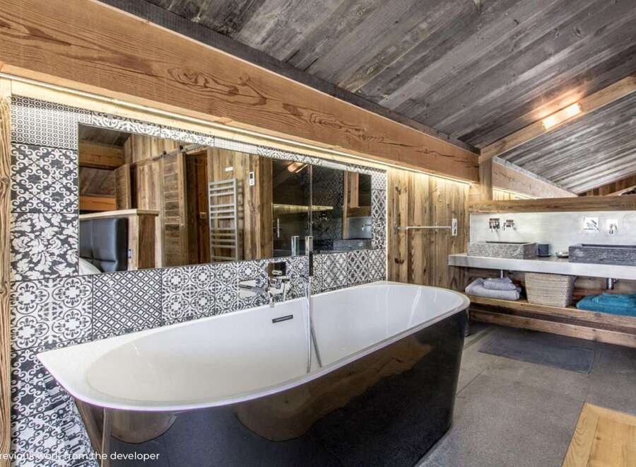 Experience rustic luxury in this stunning bathroom.