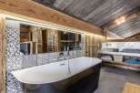 Experience rustic luxury in this stunning bathroom.