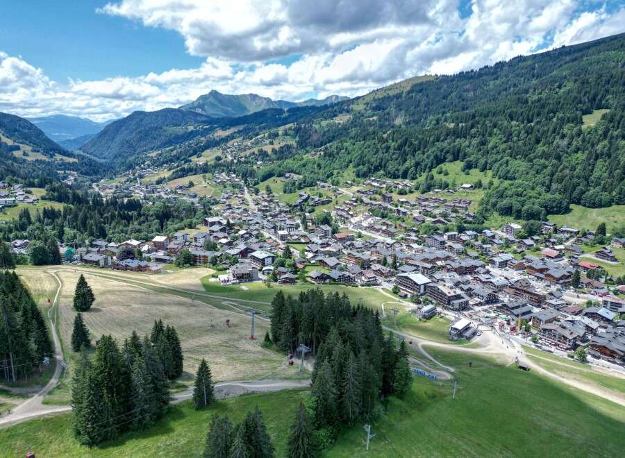 Discover the charm of this picturesque mountain village nestled amidst lush greenery and towering peaks.