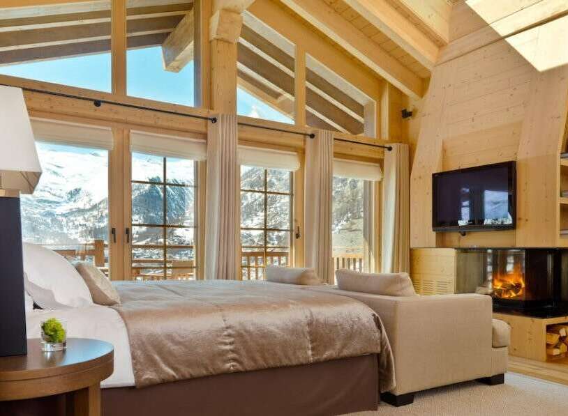 Experience luxury in this stunning chalet bedroom.