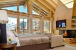 Experience luxury in this stunning chalet bedroom.