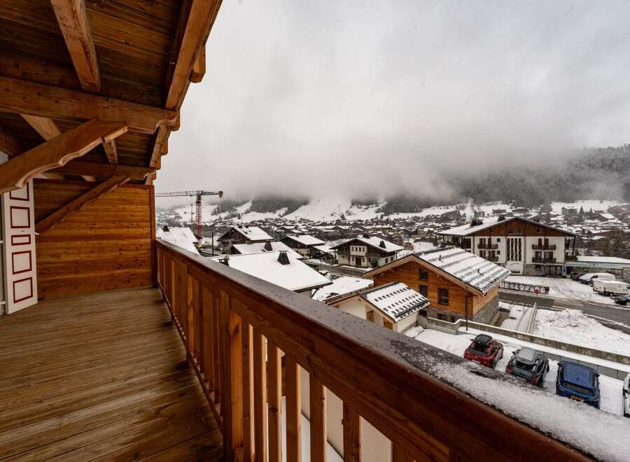 Enjoy breathtaking mountain views from this charming balcony.