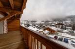 Enjoy breathtaking mountain views from this charming balcony.