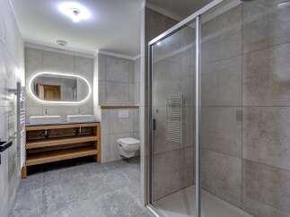 Step into a modern bathroom oasis, featuring a sleek design and high-end finishes.