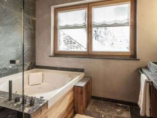Indulge in the ultimate relaxation in this luxurious bathroom.