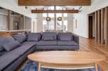 This stunning property boasts an open-concept living area with high ceilings and large windows, creating a bright and airy atmosphere.