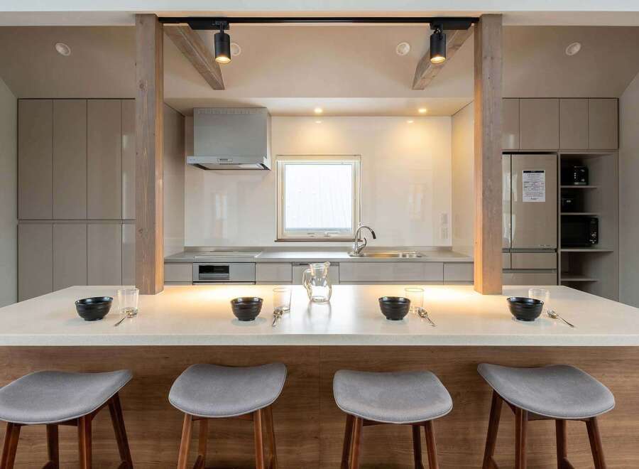 This stunning kitchen boasts a spacious island with seating, perfect for casual dining.