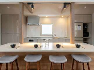 This stunning kitchen boasts a spacious island with seating, perfect for casual dining.