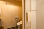 This modern hotel bathroom boasts a sleek, minimalist design with neutral tones.