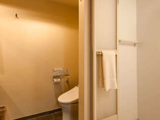 This modern hotel bathroom boasts a sleek, minimalist design with neutral tones.