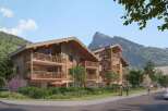 Experience mountain living in this stunning wooden apartment building, featuring spacious balconies with breathtaking views.