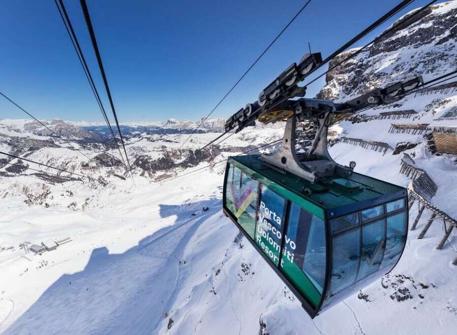 Experience breathtaking views of the Dolomites from the Porta Vescovo cable car.
