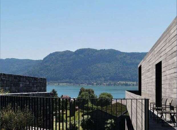 Enjoy breathtaking views of the lake and mountains from this stunning modern property.