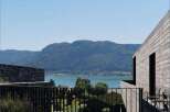 Enjoy breathtaking views of the lake and mountains from this stunning modern property.