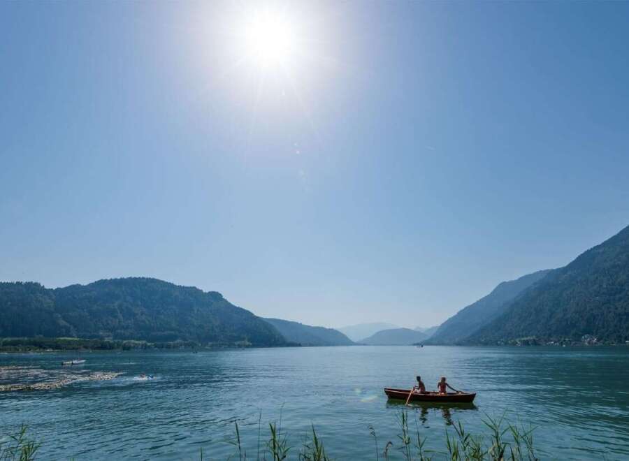 Enjoy a serene day on the lake with stunning mountain views.